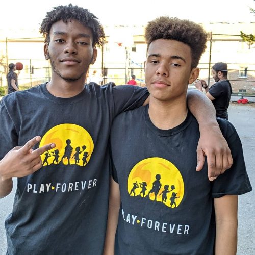 two male youth wearing Playforever t-shirts